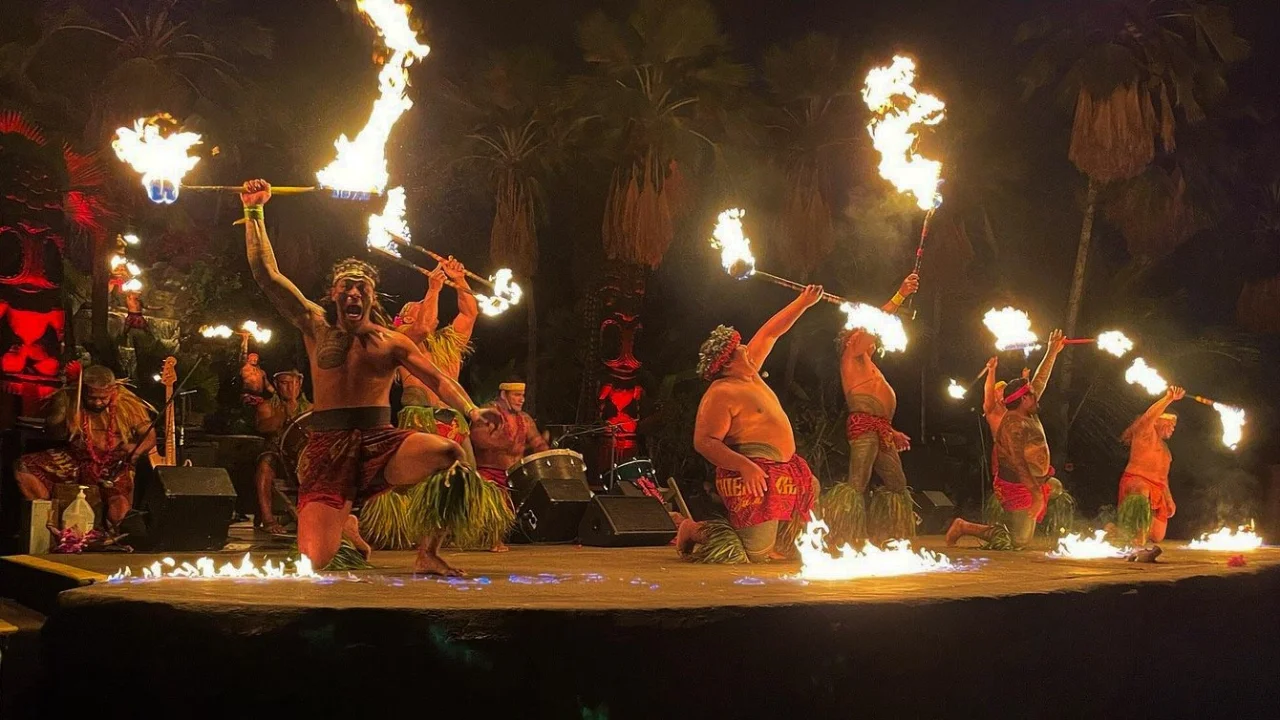 Fire knife dancers performing at an Oahu luau at night